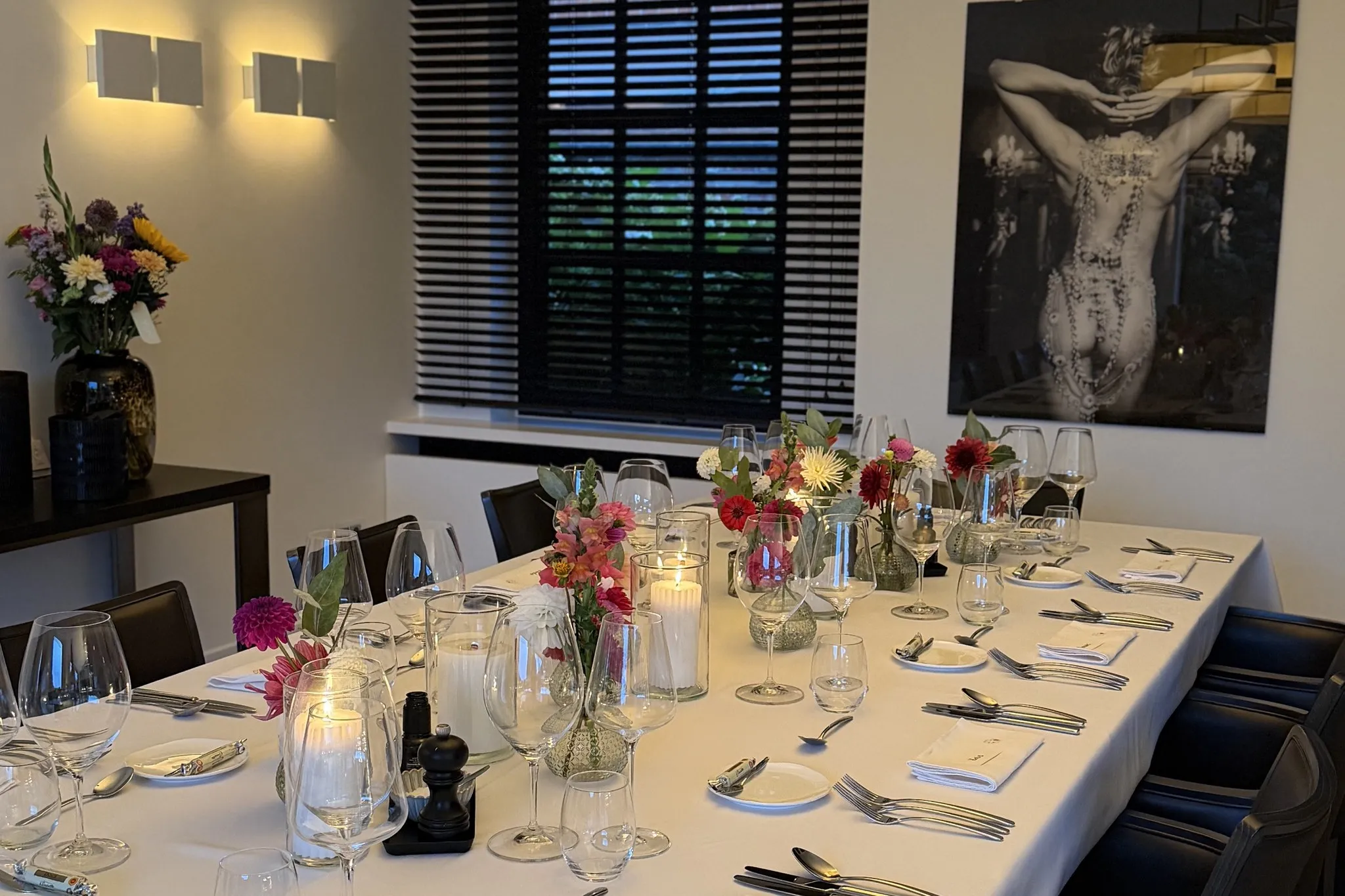 Table set with flowers and candlelight at the client's home, ready for a d.ish home cooking dinner