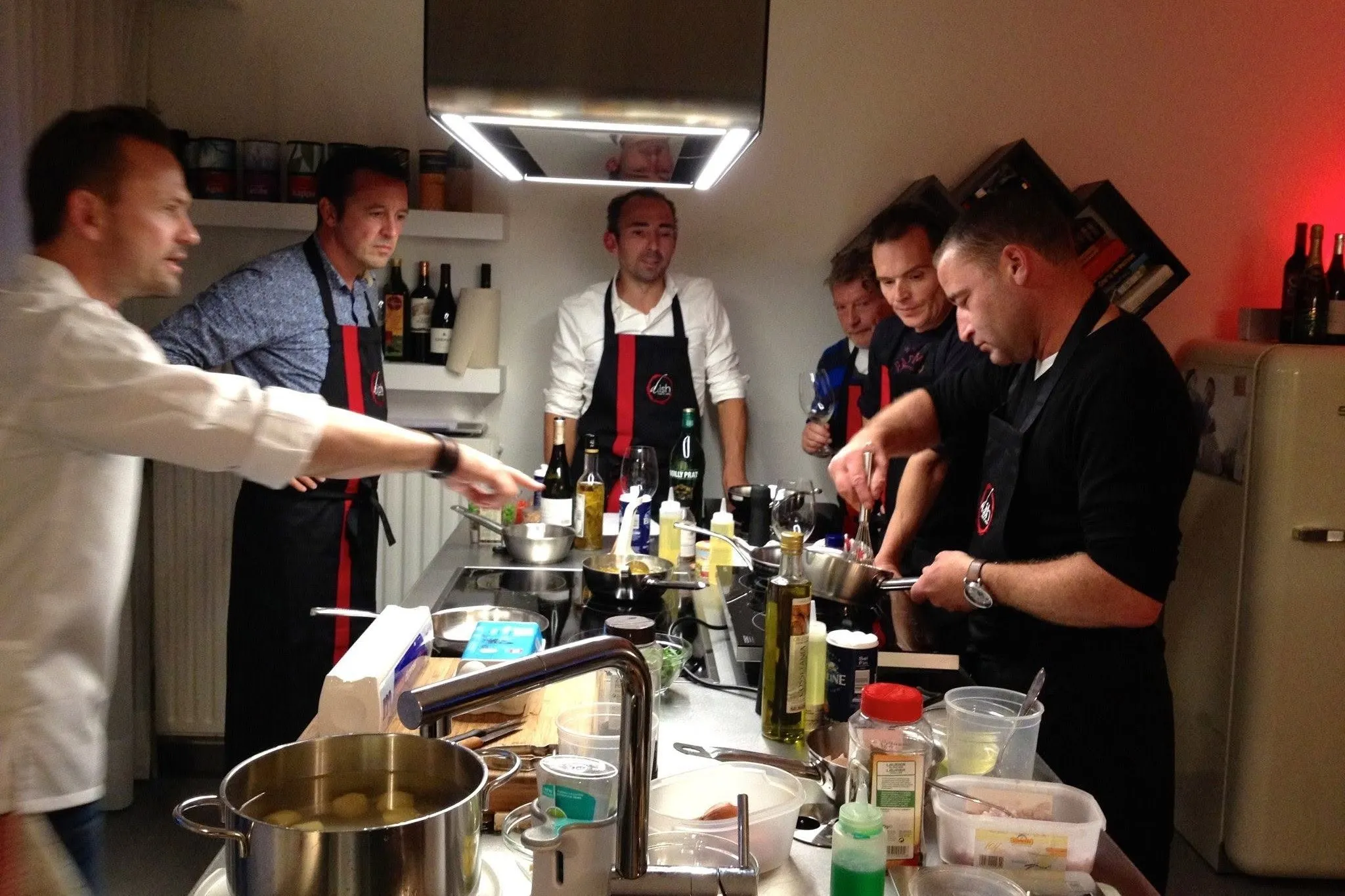 Chef guiding participants during a d.ish cooking workshop